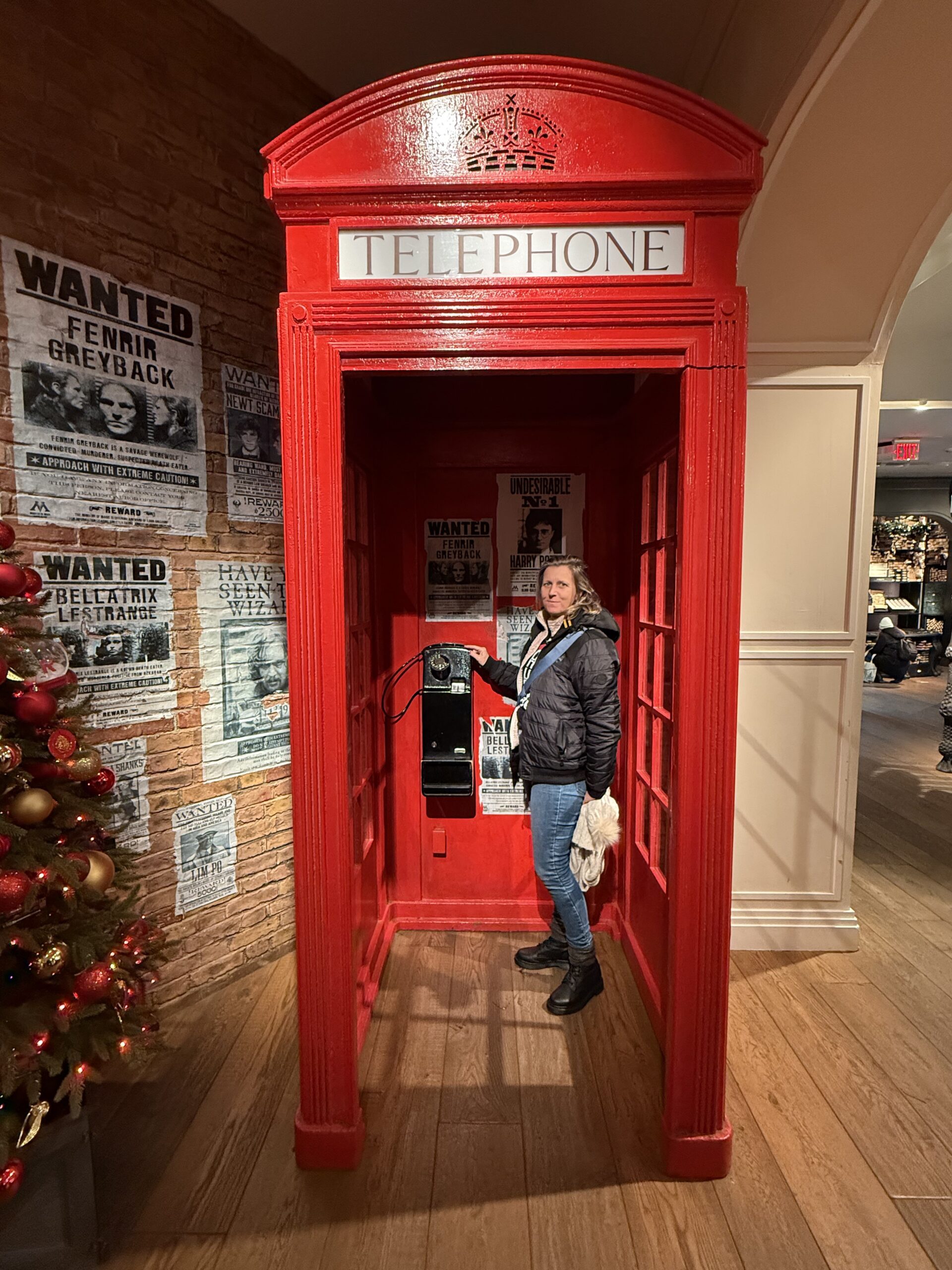 Brooklyn, New York — a man standing in a red phone booth