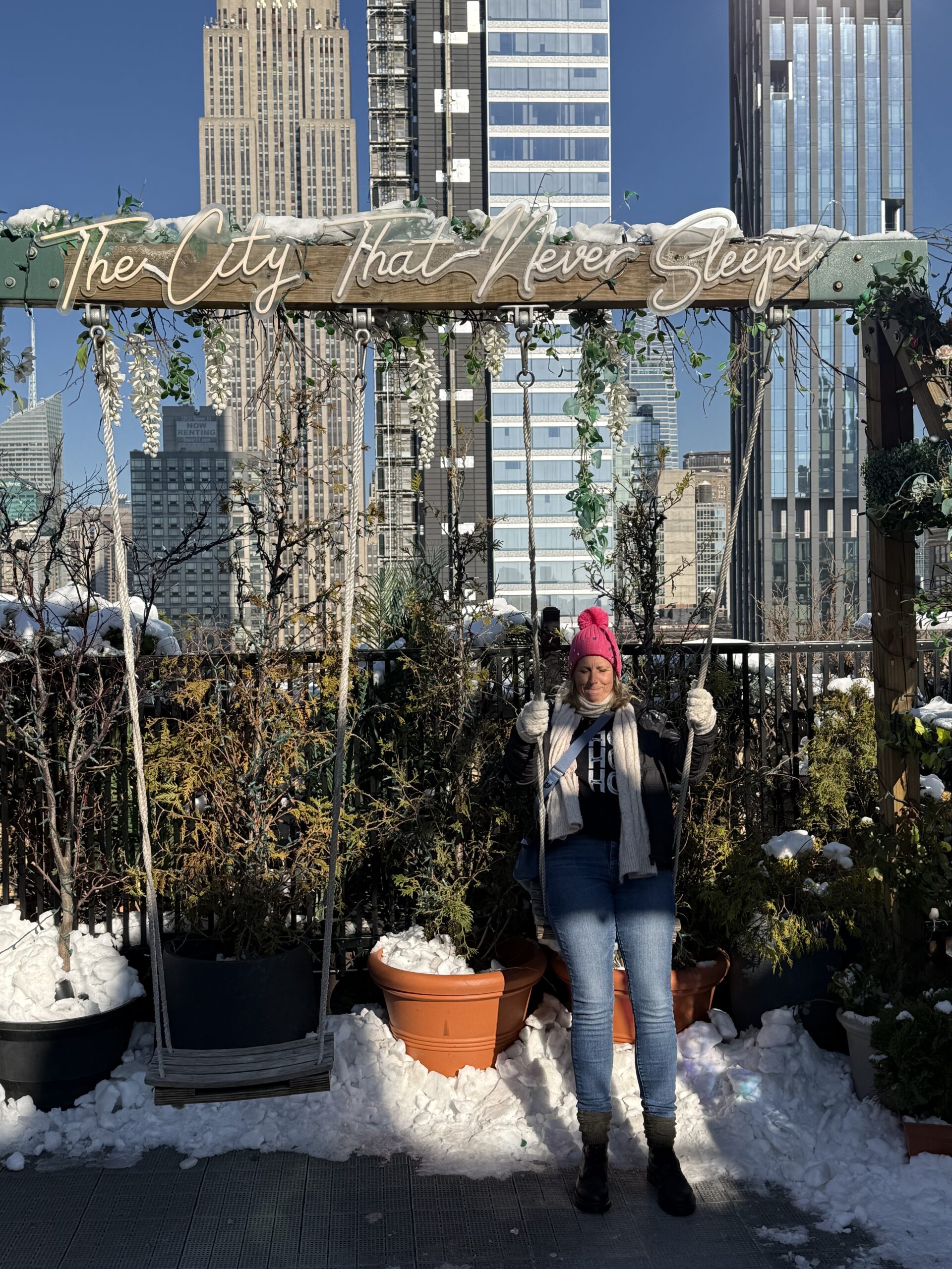 Brooklyn, New York — a woman standing in the snow in front of a building