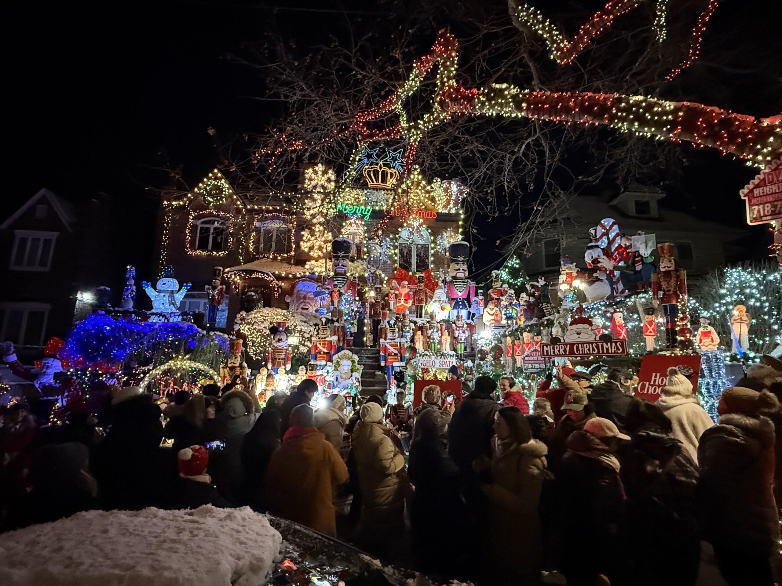 Brooklyn, New York — a crowd of people standing around a house