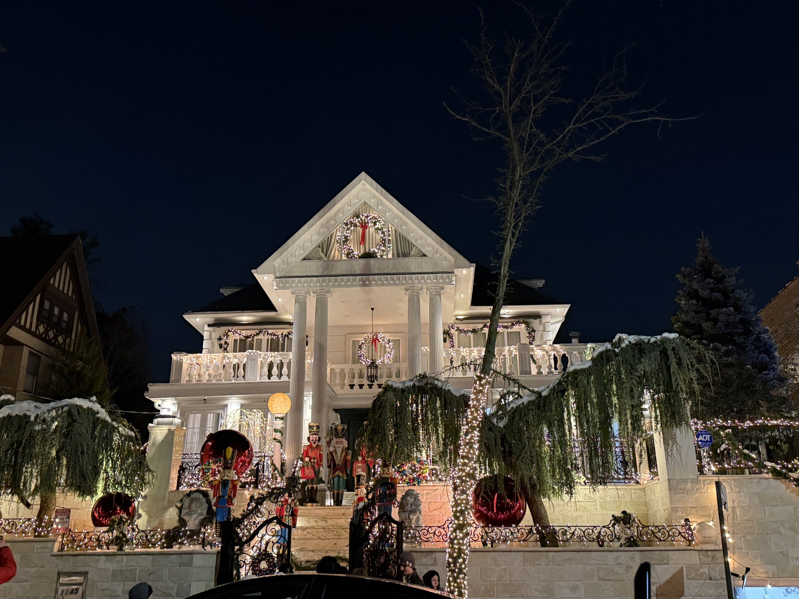 Brooklyn, New York — a large house with a christmas tree in front of it