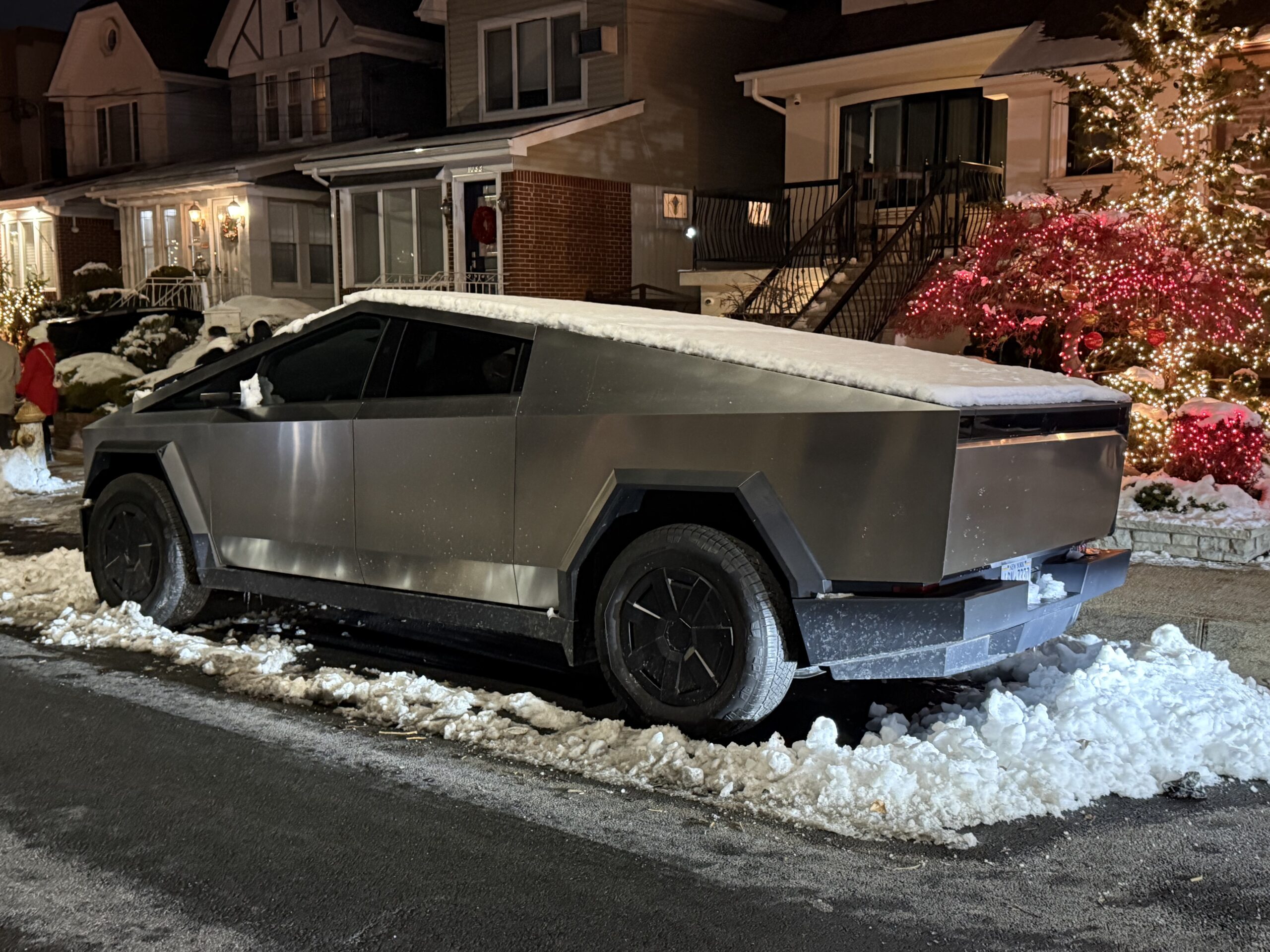 Brooklyn, New York — a car is parked in the snow on a street