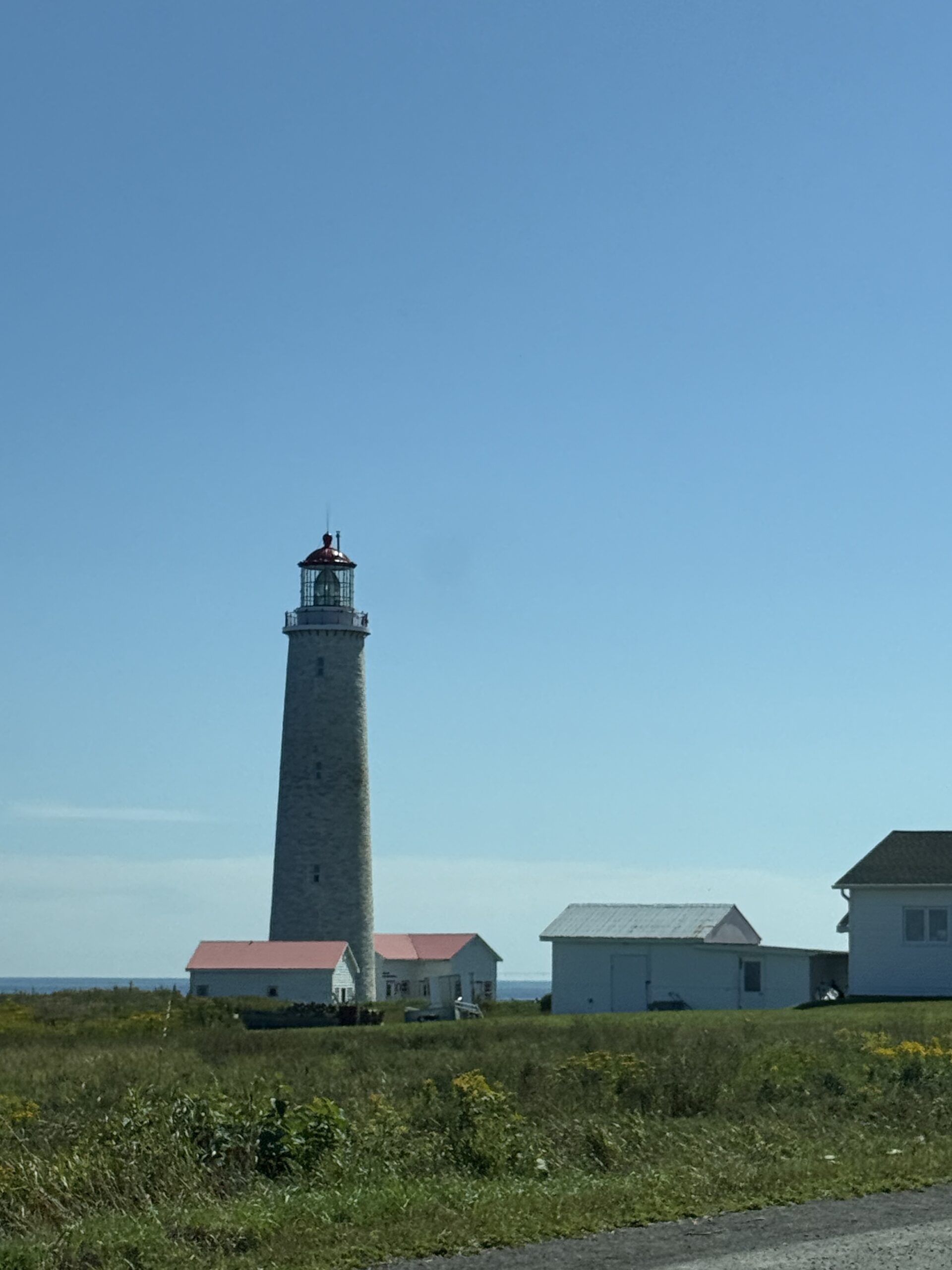 a lighthouse on a hill, Gaspé, Québec, Canada