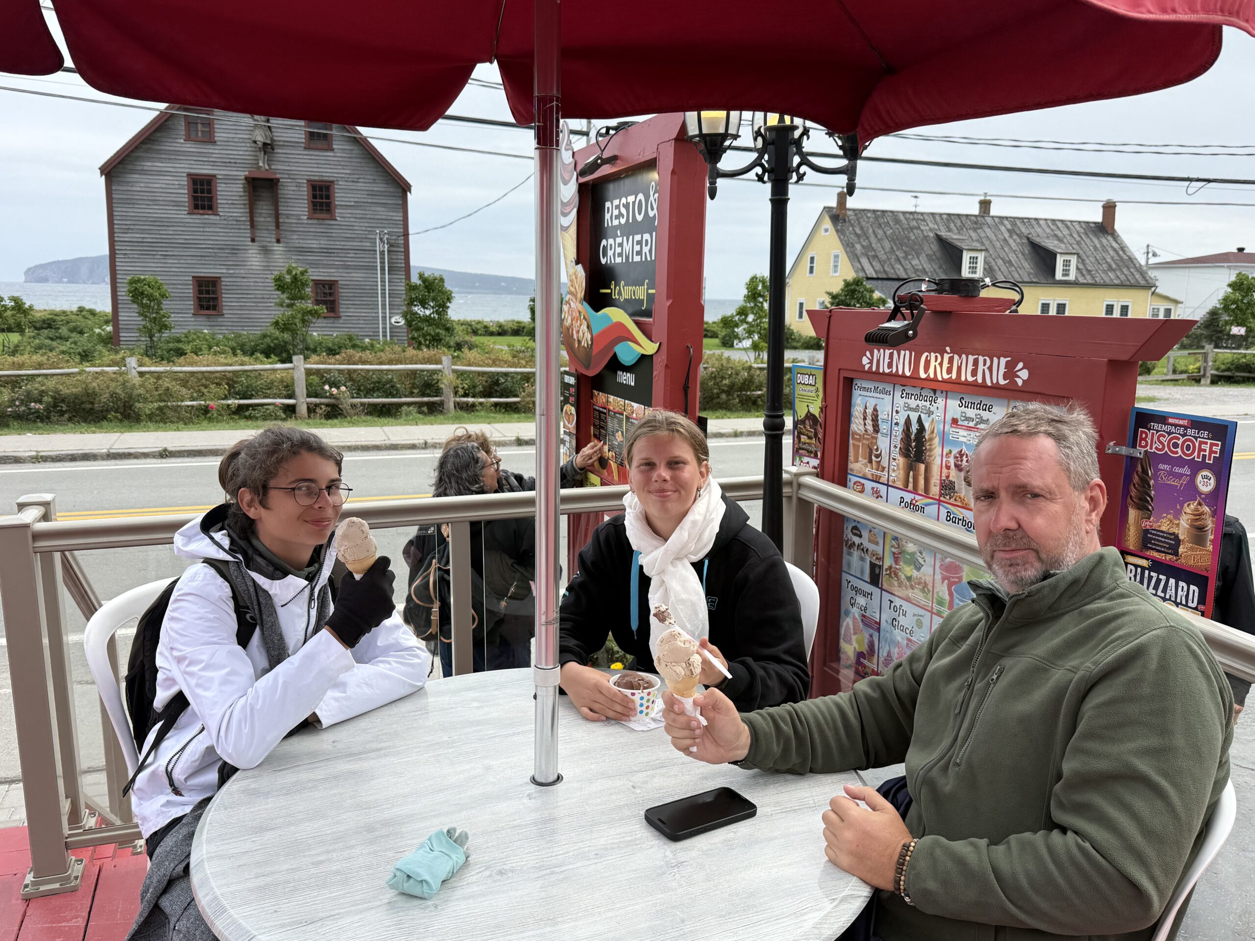a man and woman sitting at a table, Percé, Québec, Canada