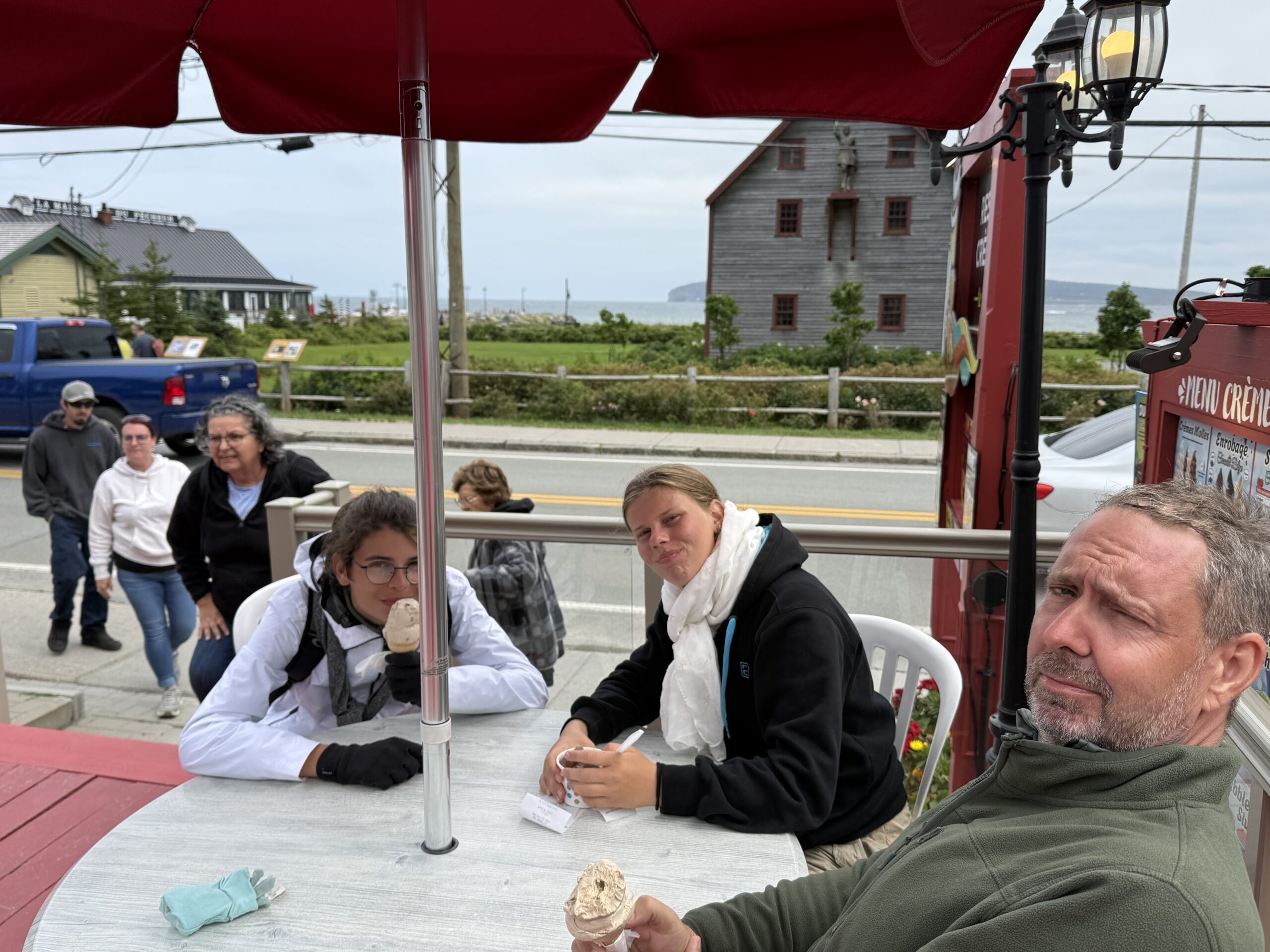 a man sitting at a table, Percé, Québec, Canada