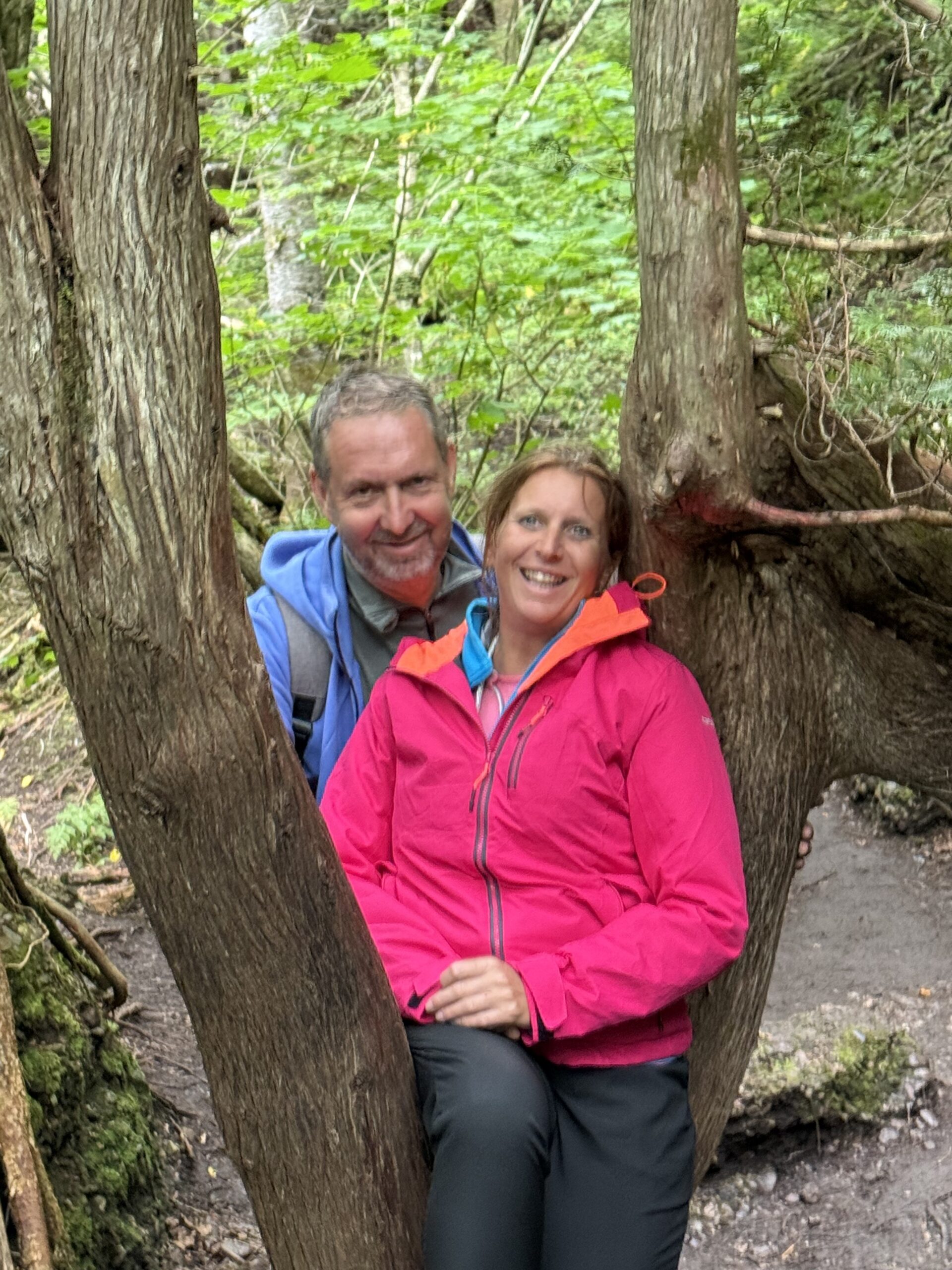 a man and woman sitting in a tree, Percé, Québec, Canada