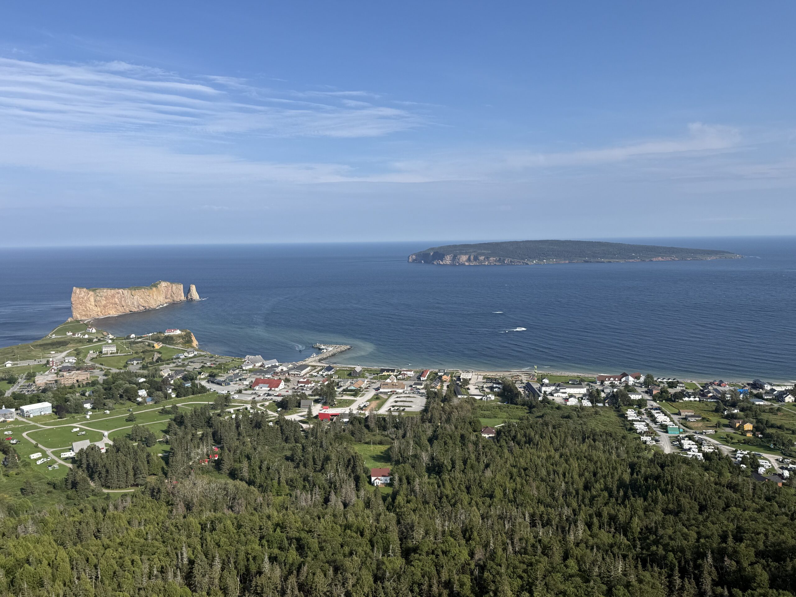 a view of a small town and a body of water, Percé, Québec, Canada