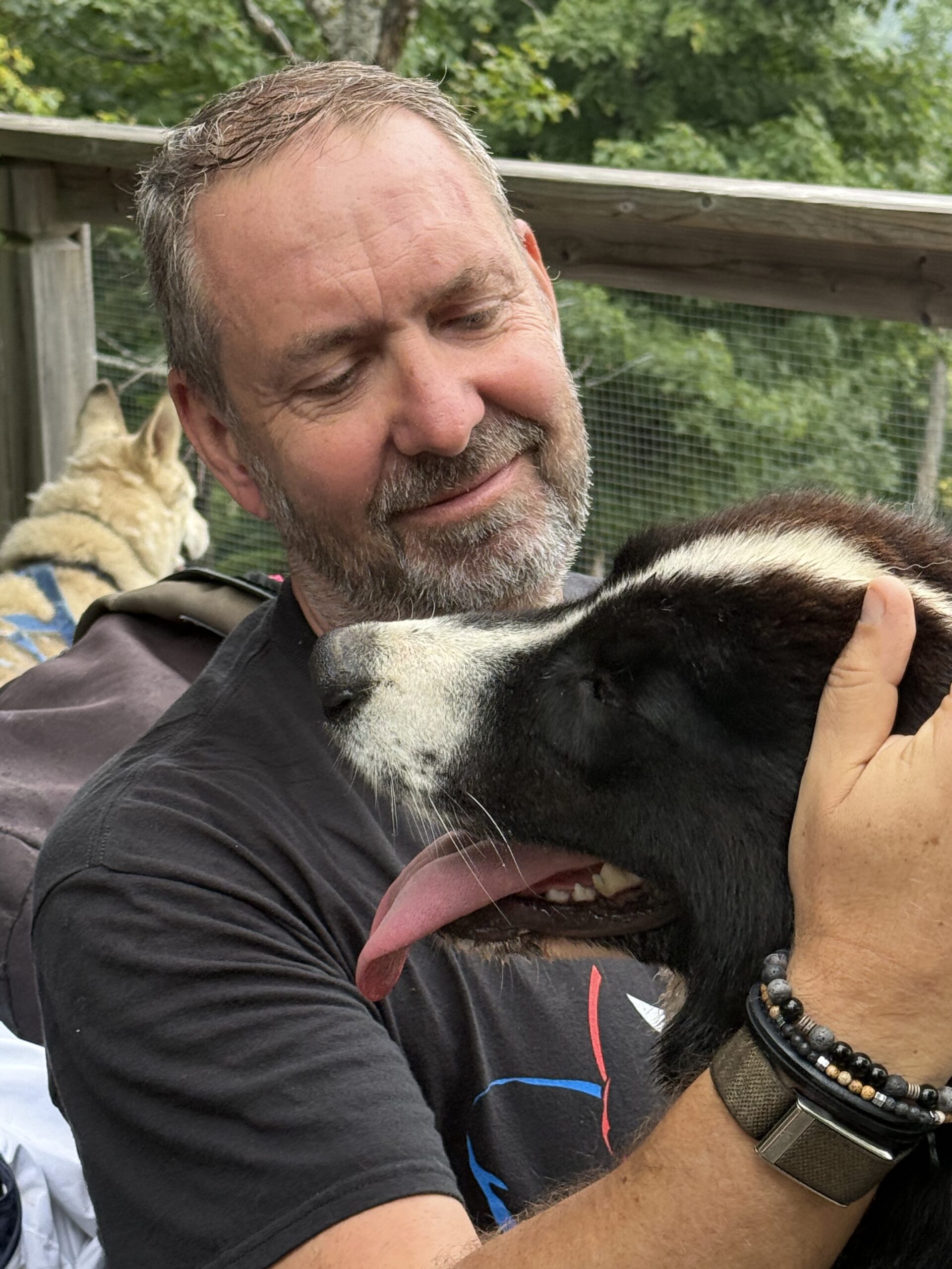 a man holding a dog, Val-des-Lacs, Québec, Canada