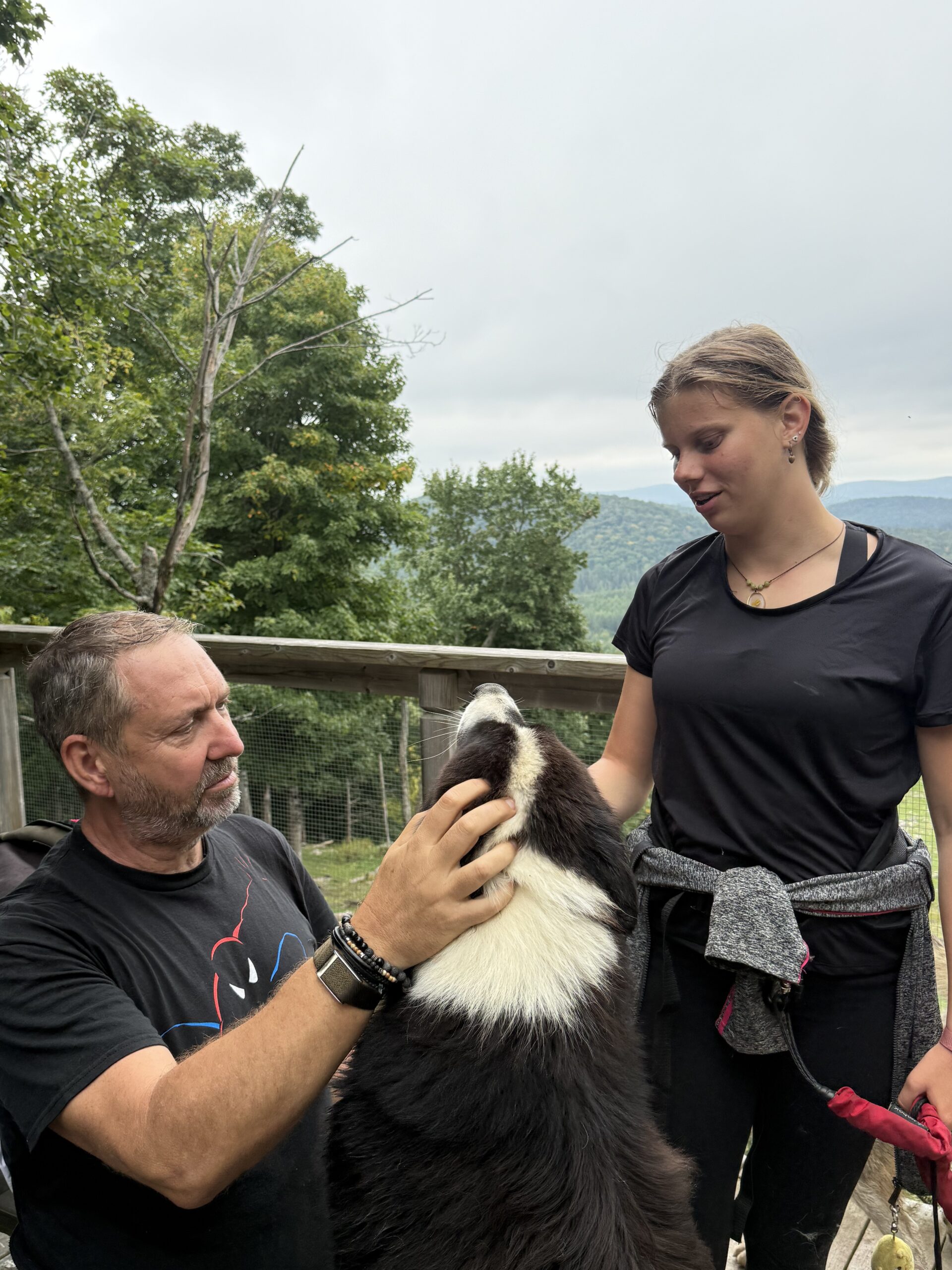 a man and woman petting a dog, Val-des-Lacs, Québec, Canada