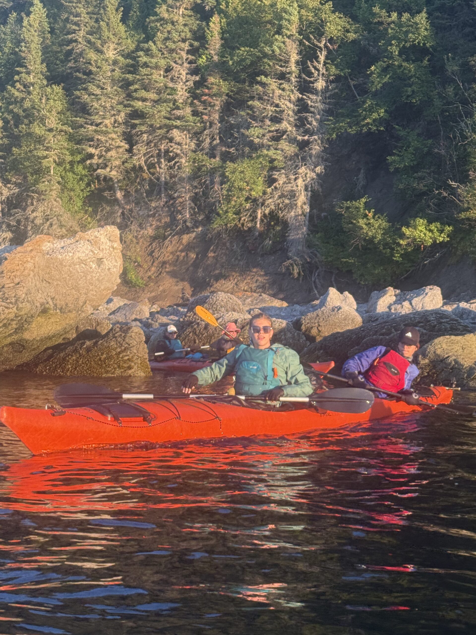 a group of people in a red kayak, Rimouski, Québec, Canada