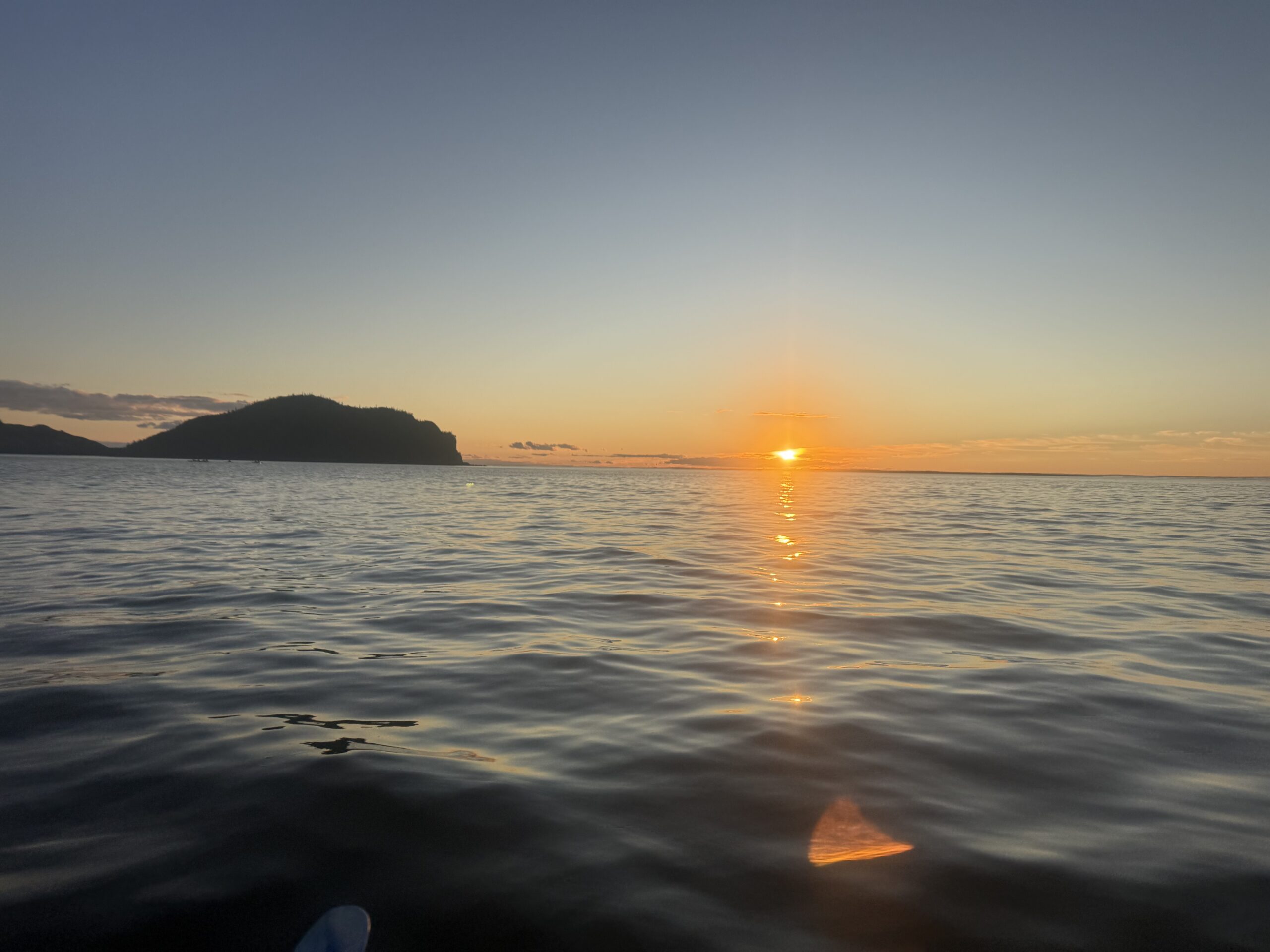 a person in a kayak pad pada, Rimouski, Québec, Canada