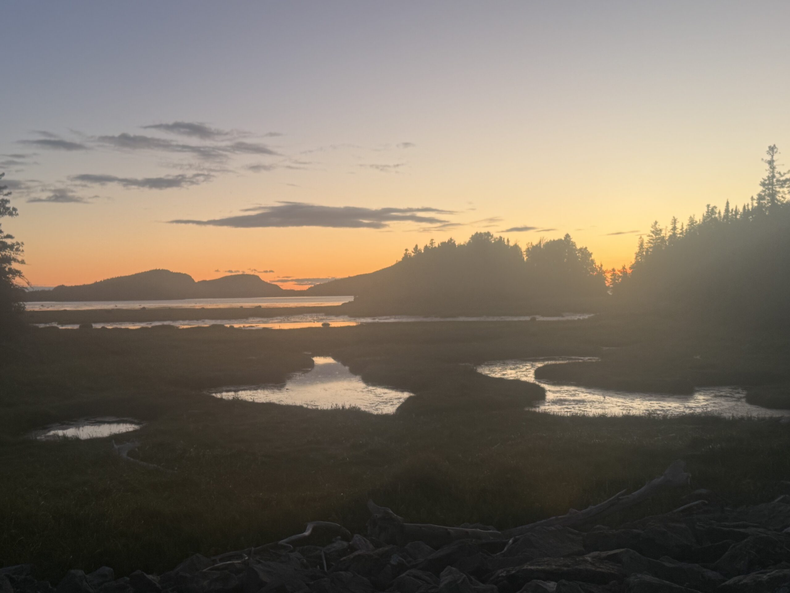 the sun is setting over the water, Rimouski, Québec, Canada