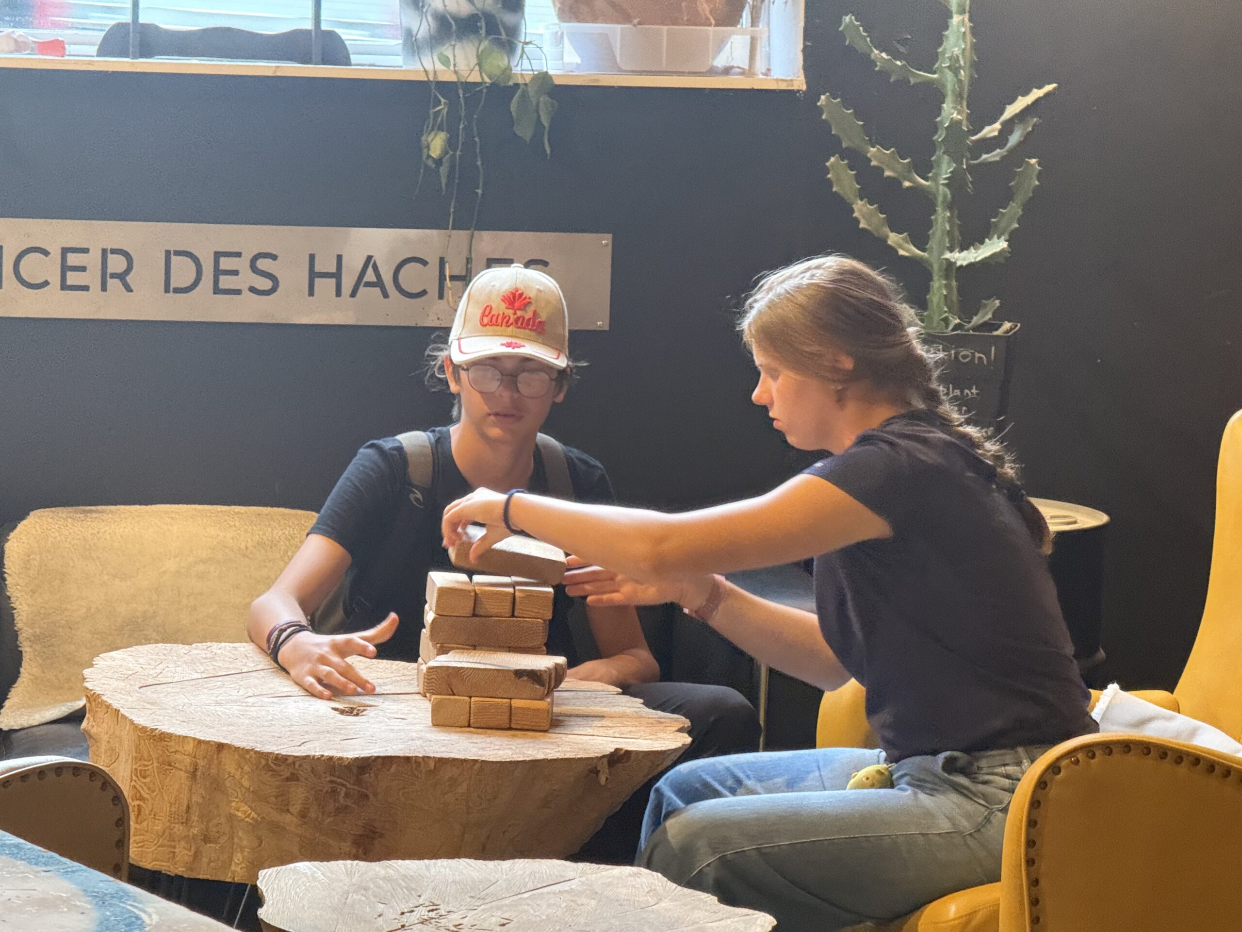 two people sitting at a table with a box on it, Montréal, Québec, Canada