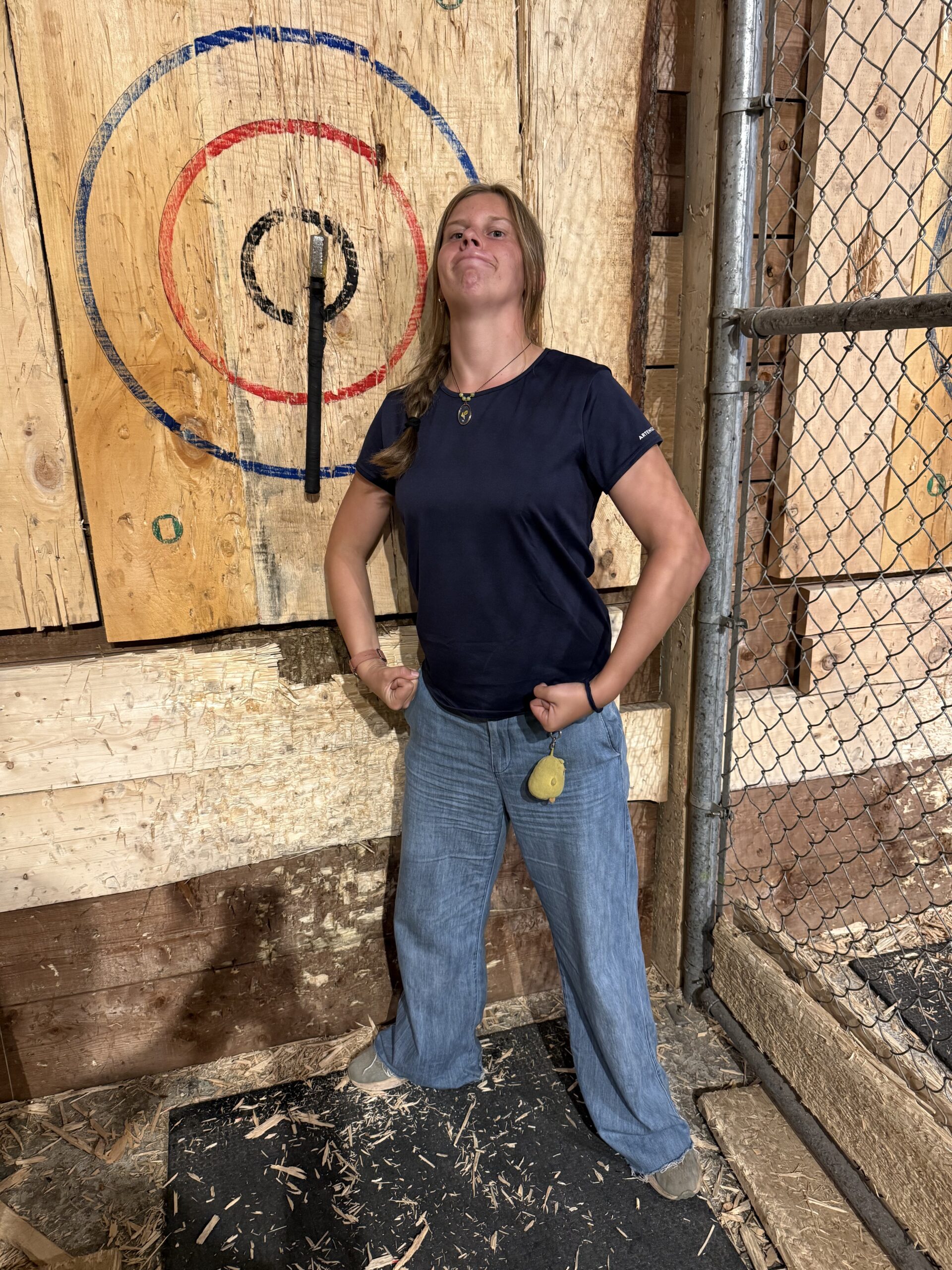 a woman standing in front of a wooden wall, Montréal, Québec, Canada