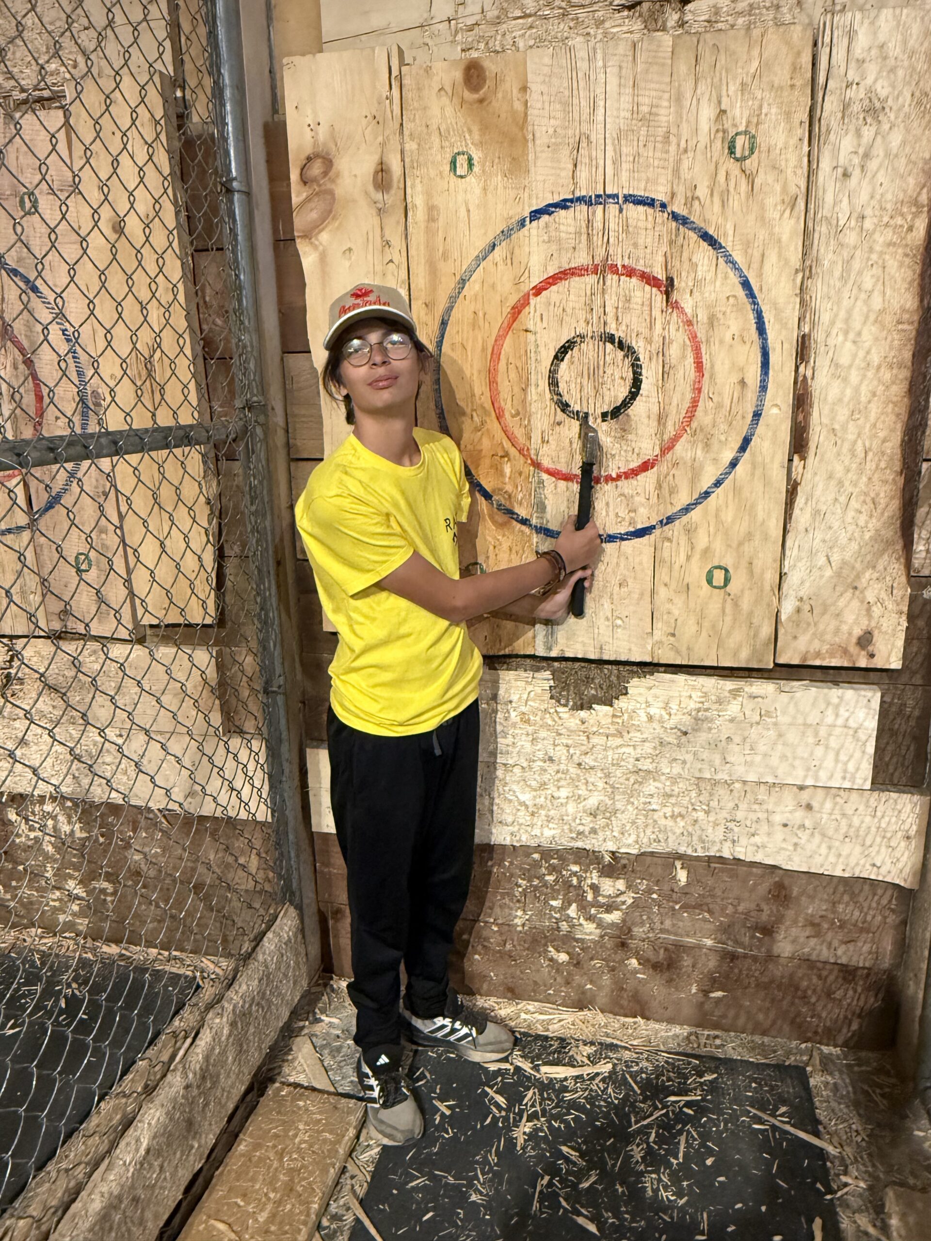 a young boy is holding a baseball bat, Montréal, Québec, Canada