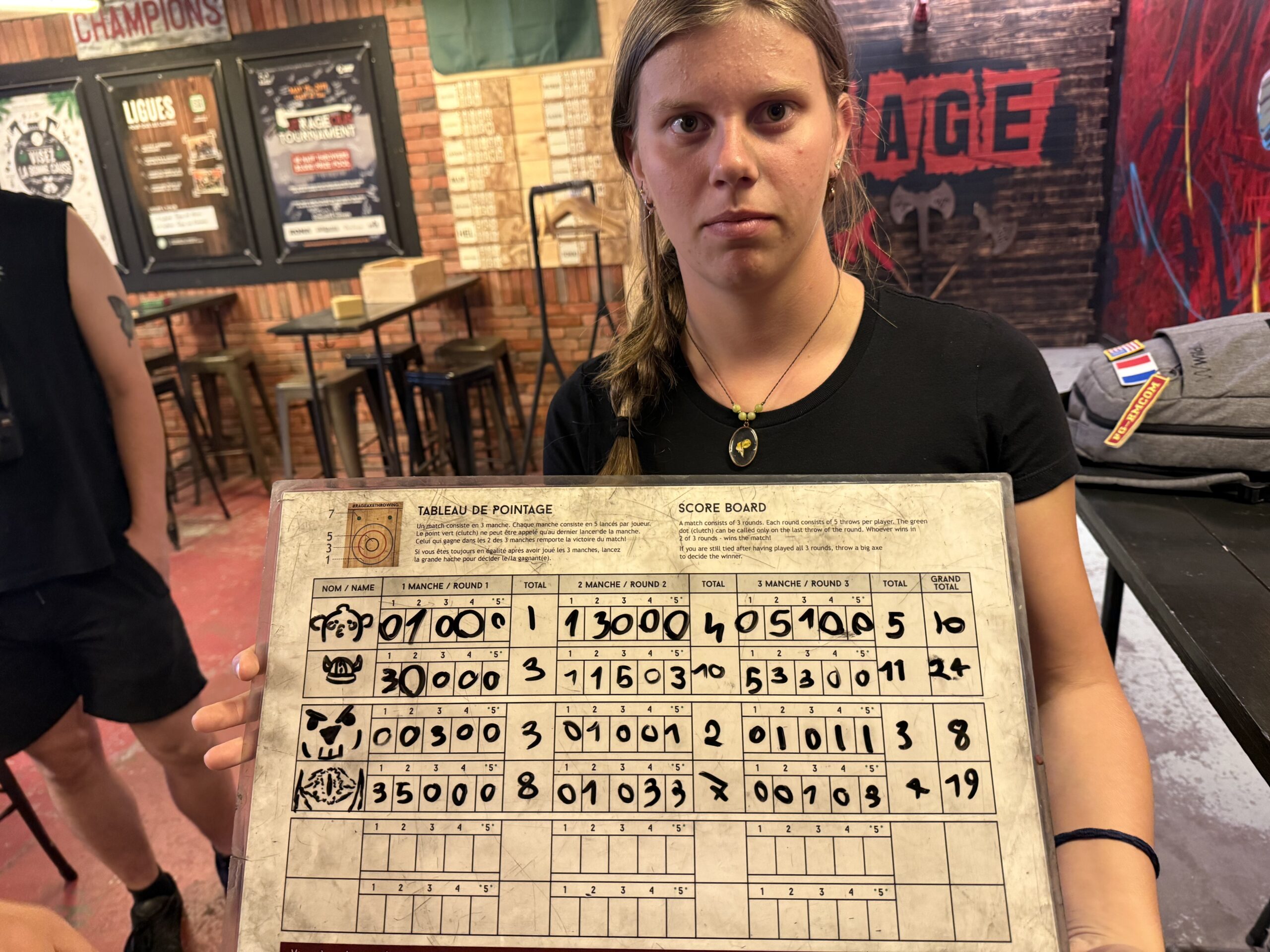 a woman holding a large piece of paper with numbers, Montréal, Québec, Canada