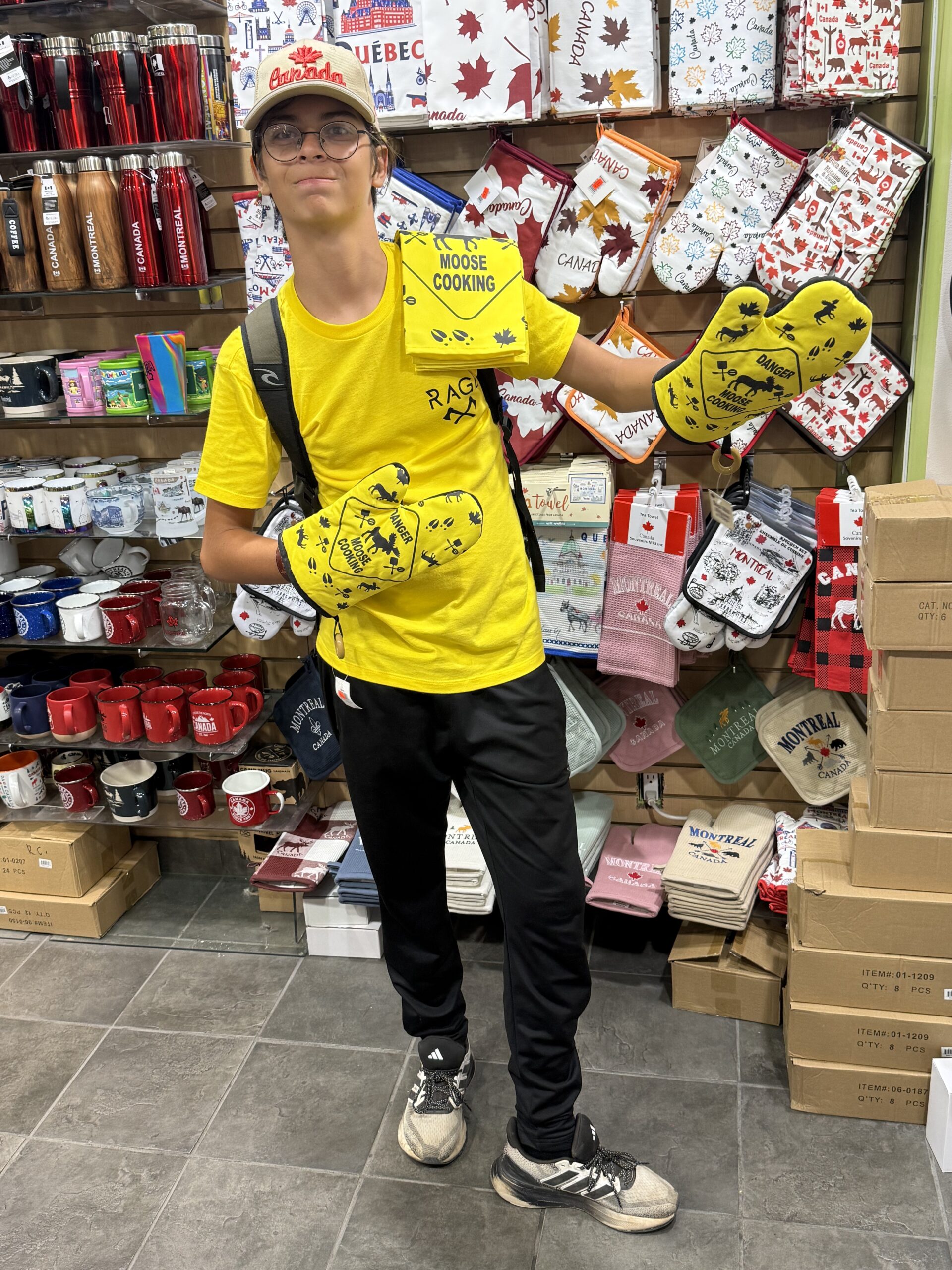 a boy in a yellow shirt and black pants, Montréal, Québec, Canada